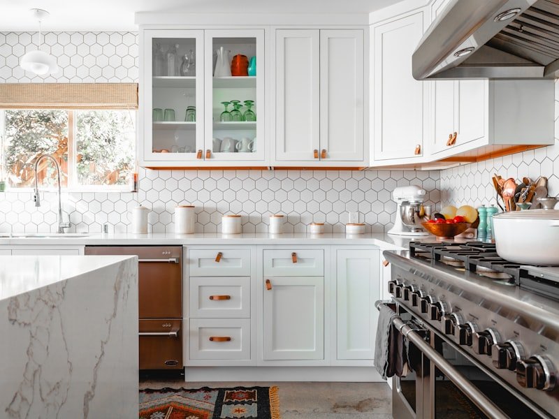 A bright white Ottawa kitchen with a hexagon tile backsplash